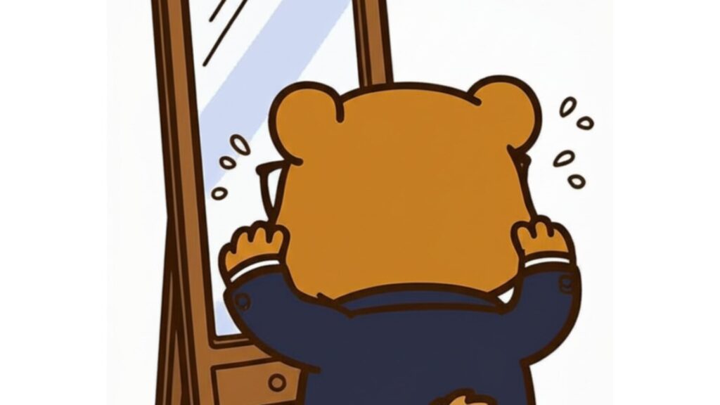鏡を見てショックを受けるくまを